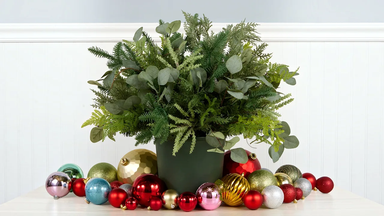 The Pre-Lit Winter Greenery Urn With Pinecones