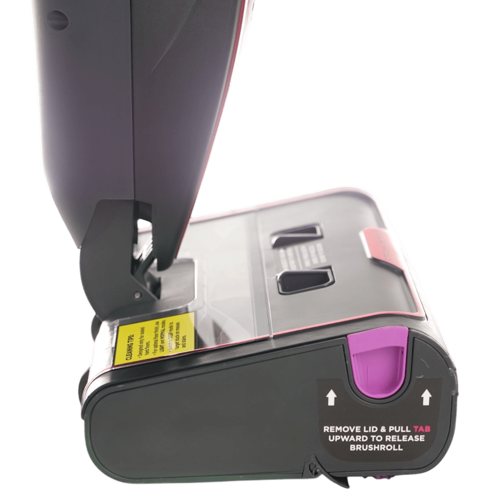 Lift the lid and pull the tab to swap brushrolls