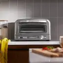 Modern stainless steel finish complements any kitchen décor.