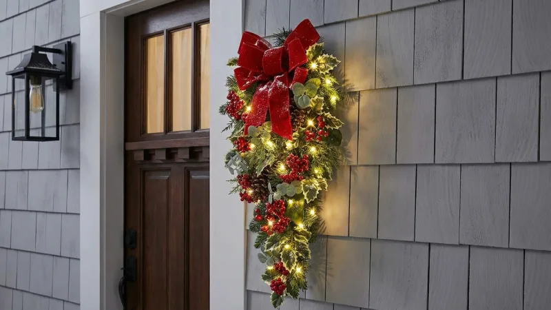 The Cordless Prelit Holly/Berries/Ribbon Holiday Sconce