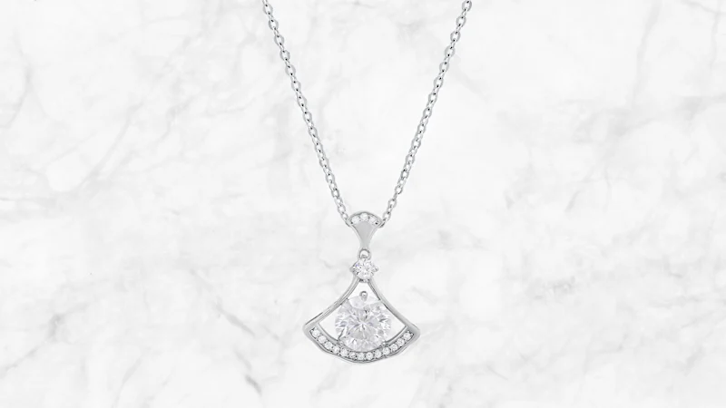 Saffron 1.0 Carat TW Moissanite Saturn Pendant Sterling Silver Necklace