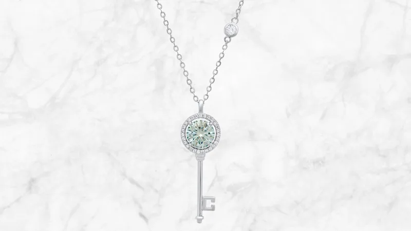Saffron 1.0 Carat TW Turquoise Moissanite Key Pendant Sterling Silver Necklace