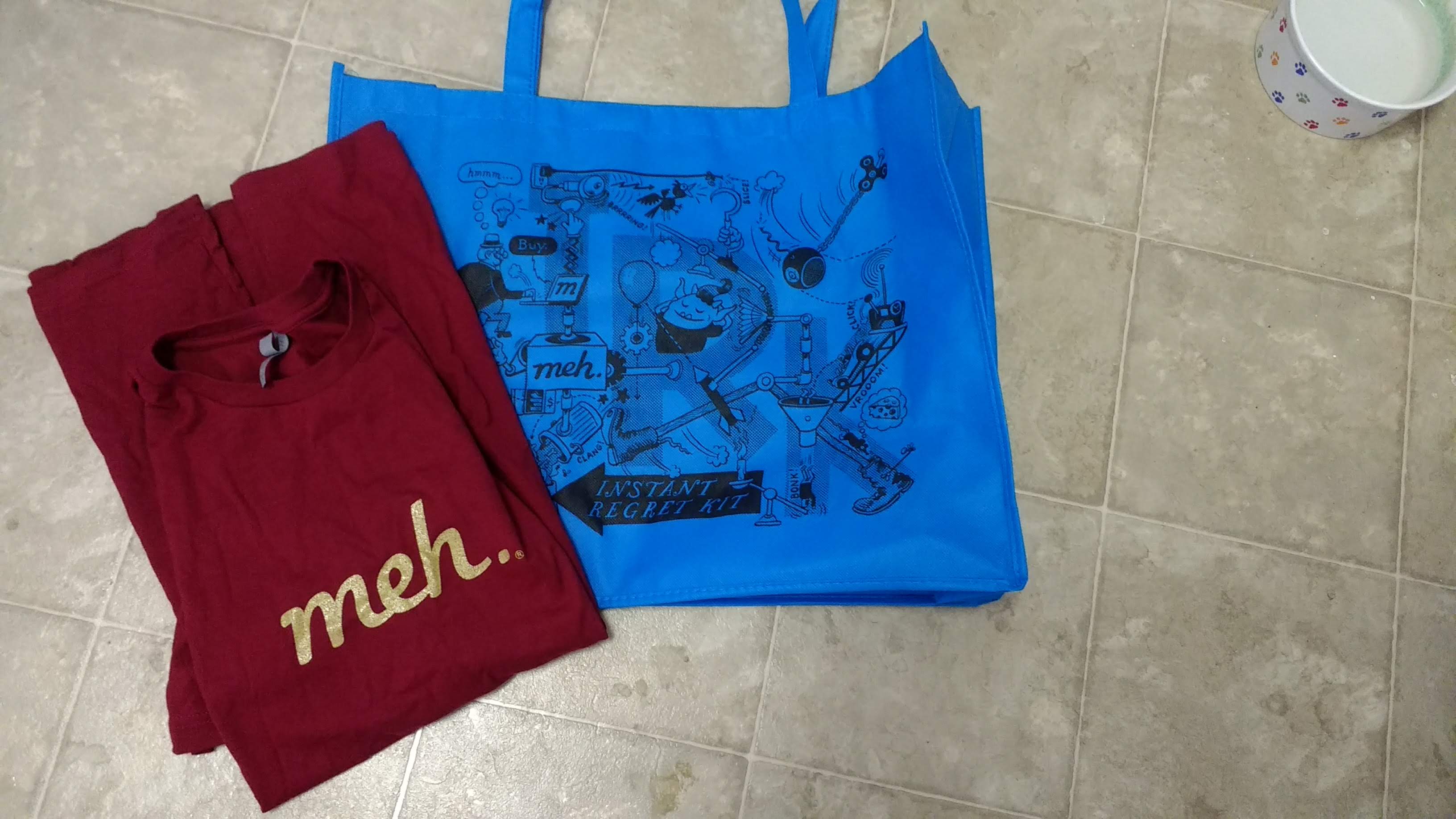 a bright blue IRK bag and my exclusive tour t-shirt