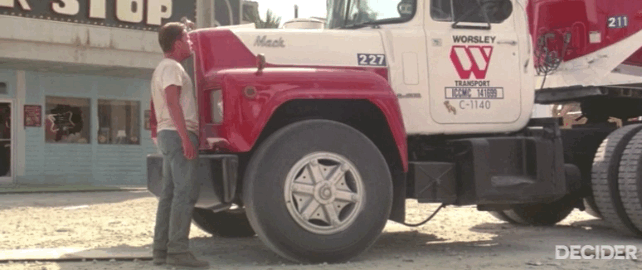 Emilio Estevez standing up to a Mack truck