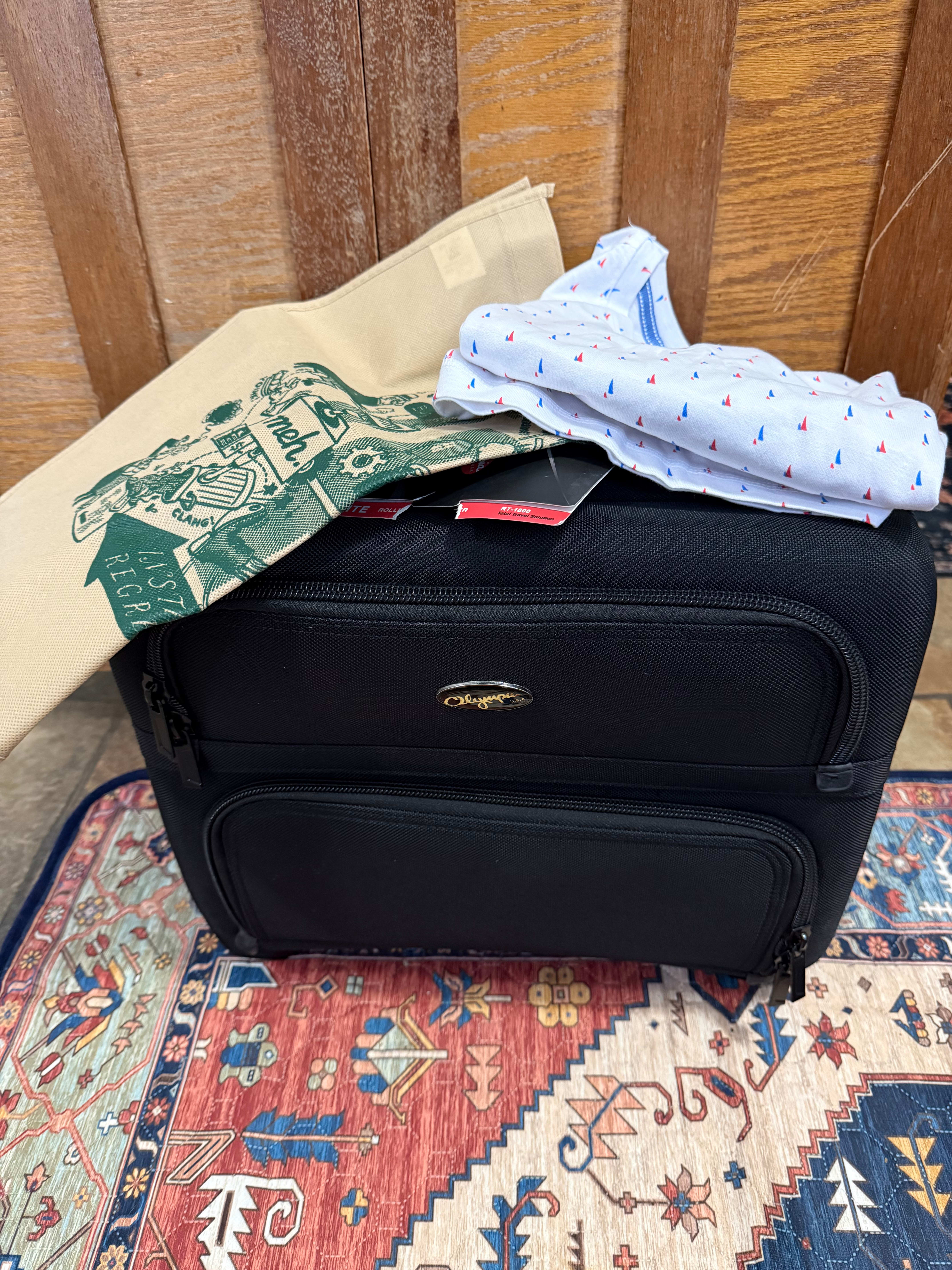 International reports men’s sailboat polo, tan irk bag (do love the green lettering) and an olympia rt1800 overnight rolling bag. Had secretly hoped for the pinstripe luggage others have posted but this is really good and equally useful if not as cute 😂 very happy with my irk! 