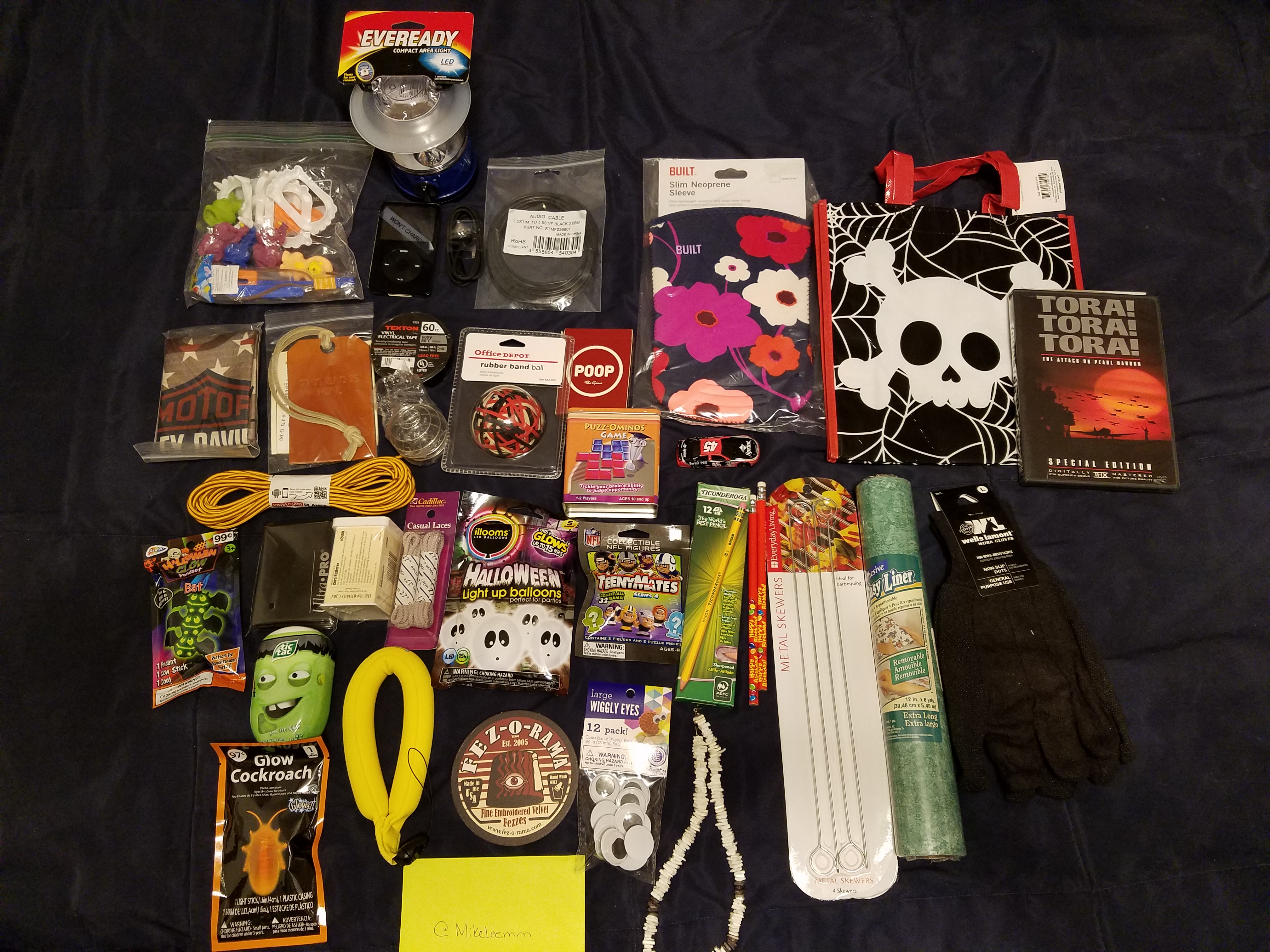 It took longer than I wanted to get these posted but, here we go, first box received from @pamtha!  Lots of goodies here, Halloween themed goodies, goodie bag, lantern, ipod (won't charge it says), paracord, luggage tag, card sleeves, laces, shaker ball, Harley, Tic Tacs, corn butterer, glow lights, balloons, coaster, rubber band ball, USB cable, audio cable, eyes, puzzles, poop game,  pencils and more happy birthday pencils, necklace, skewers, yellow floatie thingie, shelf liner, gloves, gift bag, dvd movie Tora Tora Tora, and last but not least, the Meh classic, neoprene sleeve.